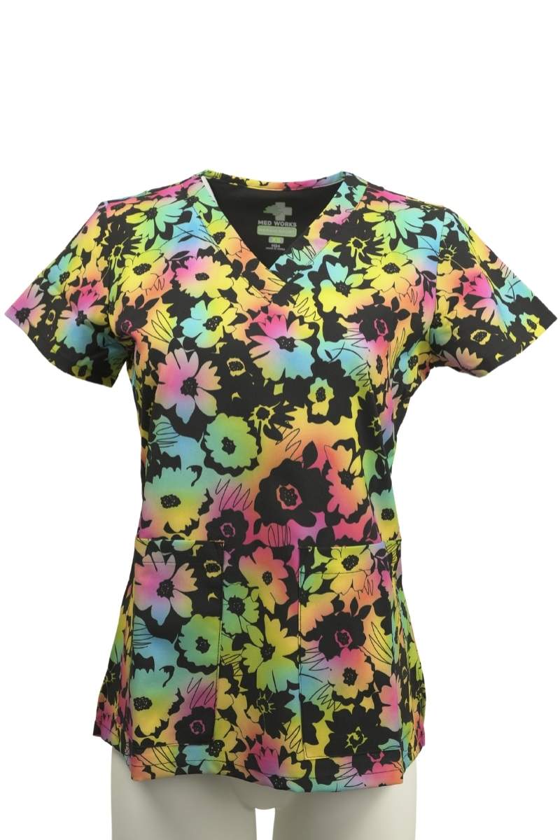 The front of the Meraki Sport Women's Print Scrub Top in "Floral Glow" featuring two front patch pockets.