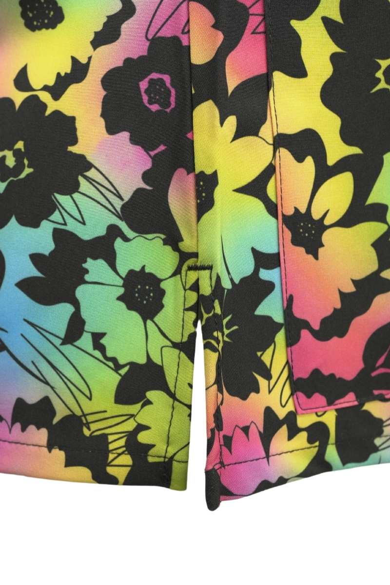 A close look at the side slits on the Meraki Sport Women's Print Scrub Top in Floral Glow.