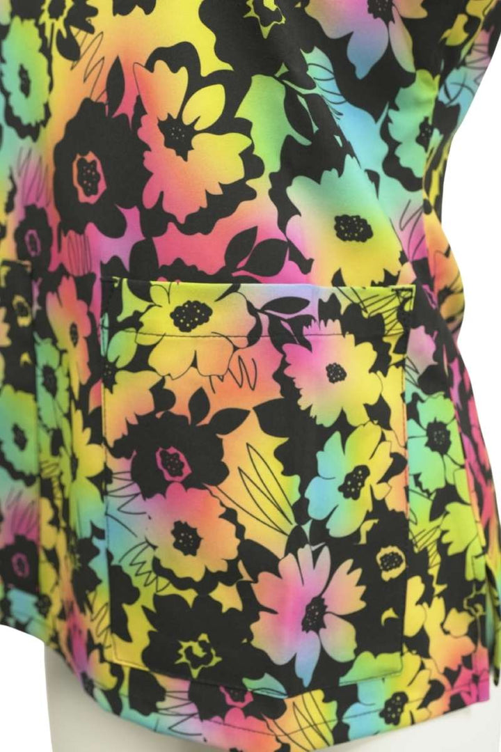 A close look at the front left patch pocket on the Meraki Sport Women's Print Scrub Top from MedWorks in Floral Gow.