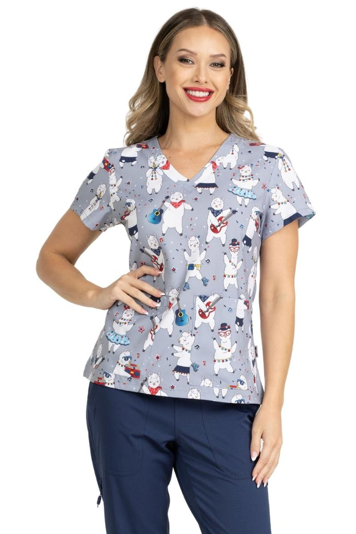 A close look at the front of the Meraki Sport by MedWorks Print Scrub Top in Llamazing featuring a v-neckline & short sleeves.