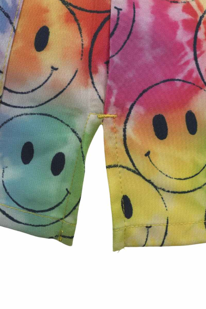 A close look at the side slit on the Meraki Sport Women's Printed Scrub Top in Smiley Days.