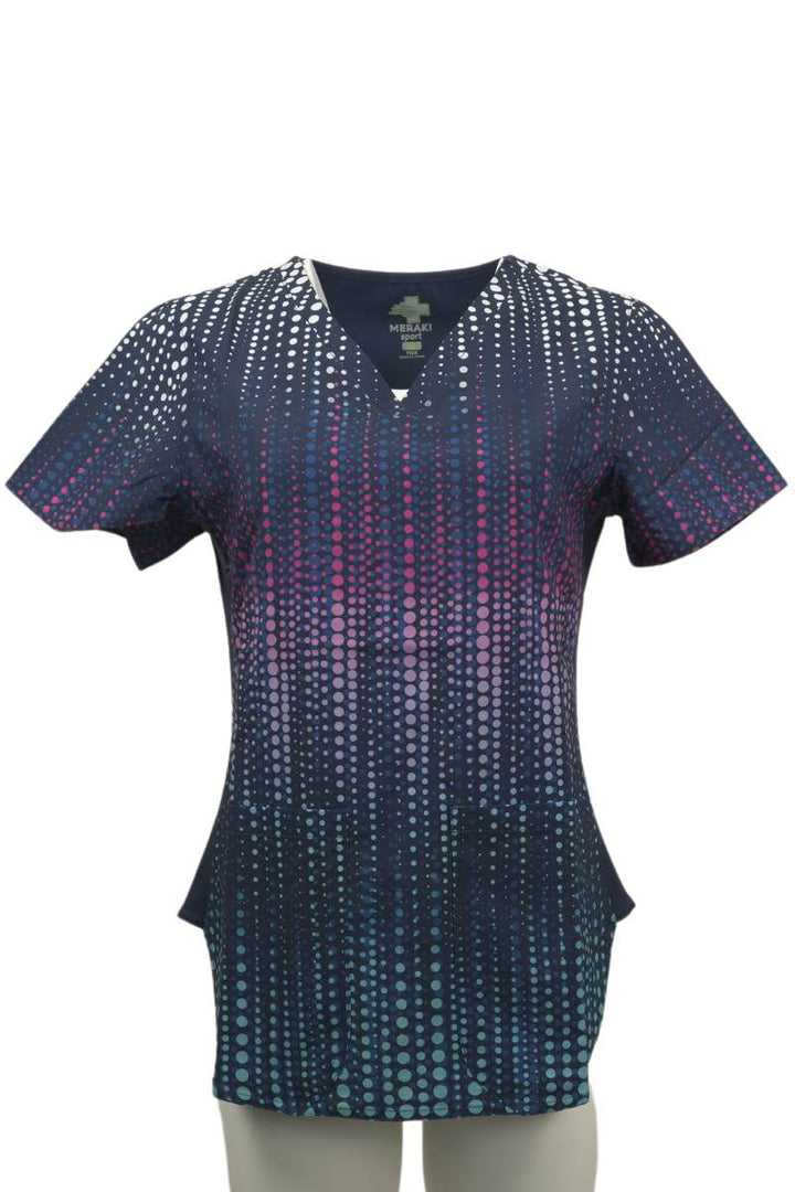 The front of the Meraki Sport Women's Print Scrub Top in Dazzle n Dots featuring two front patch pockets.