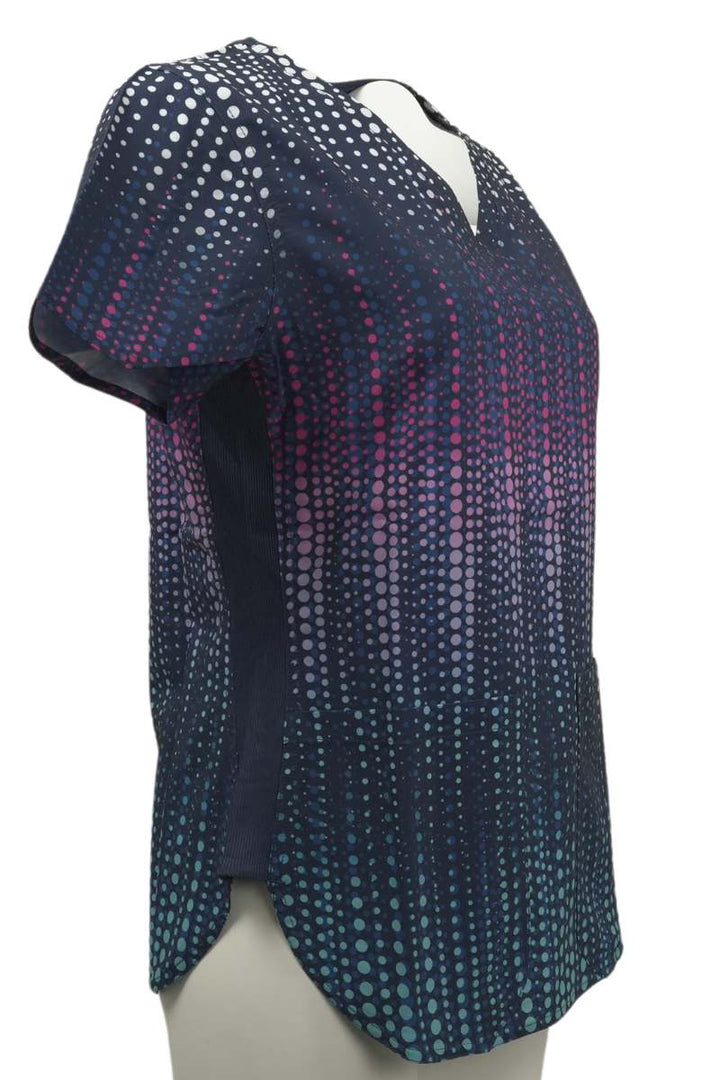 The right side of the Meraki Sport Women's Print Scrub Top in Dazzle n Dots featuring short sleeves.