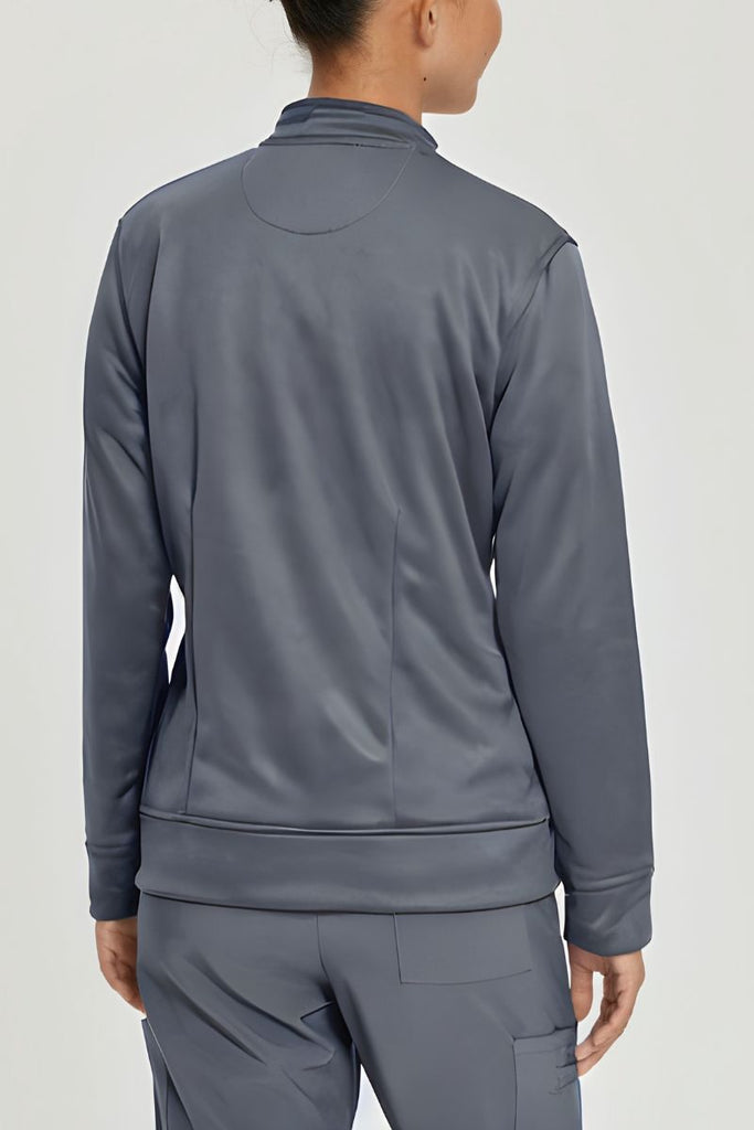 A close look at the back of the Urbane Performance Women's zip-Up Scrub Jacket in Steel Grey featuring fade and wrinkle resistant 4-way stretch fabric.