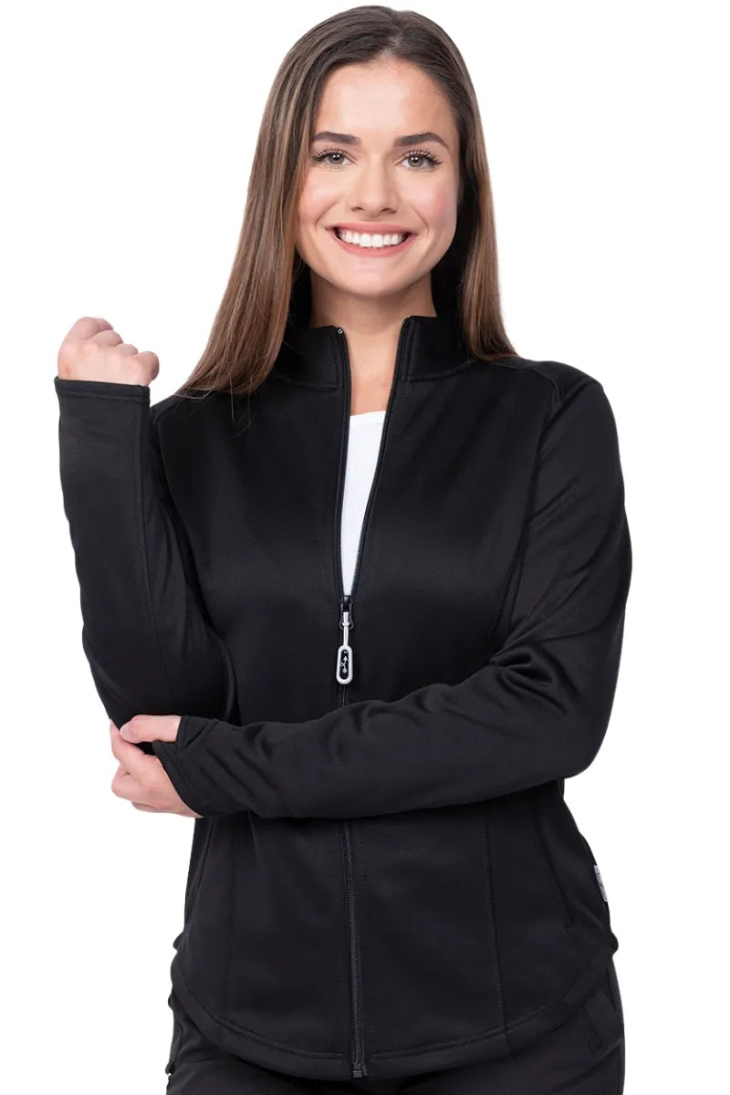 A young female Clinical Laboratory Technician wearing a wearing an Ava Therese Women's Bonded Fleece Jacket in Black size XL featuring a soft, light fleece has an anti-static finish.