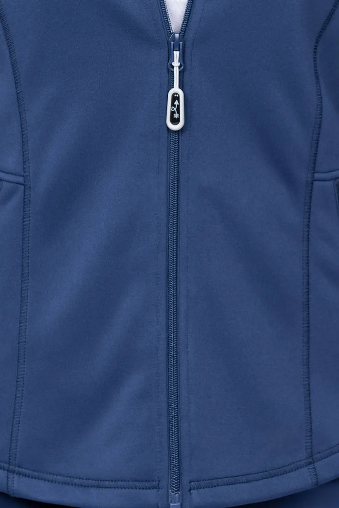 An up close image of the full zip closure on the Ava Therese Women's Bonded Fleece Jacket in Navy size small.