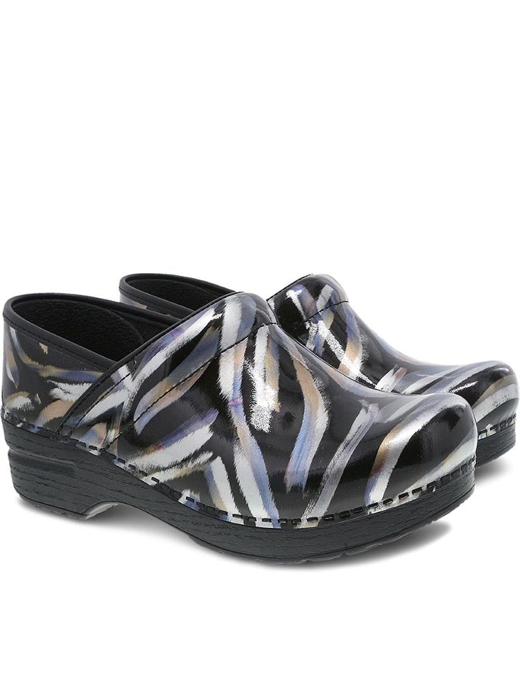 A pair of Dansko Professional Nurse Clogs in Metallic Brush Patent featuring a 2" heel height.