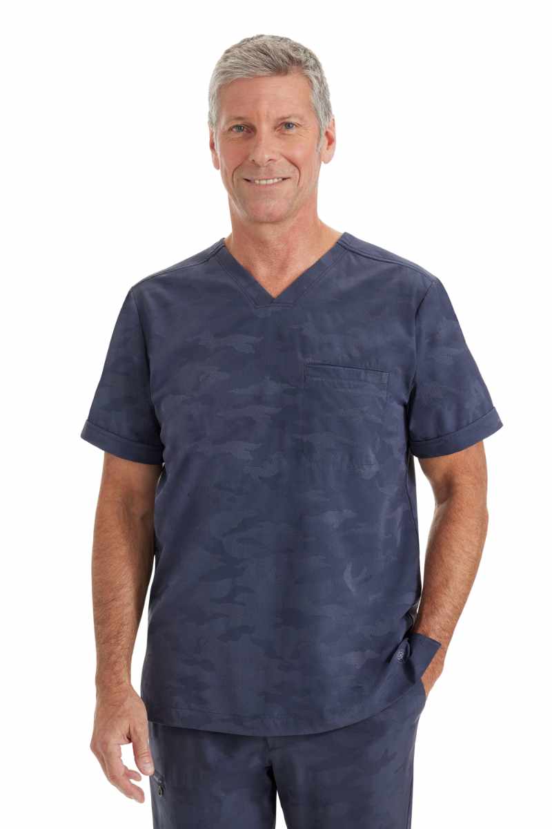 A male Occupational Therapist wearing a Purple Label by Healing Hands Men's Jack Camo Scrub Top in "Pewter" size XL featuring a modern fit.