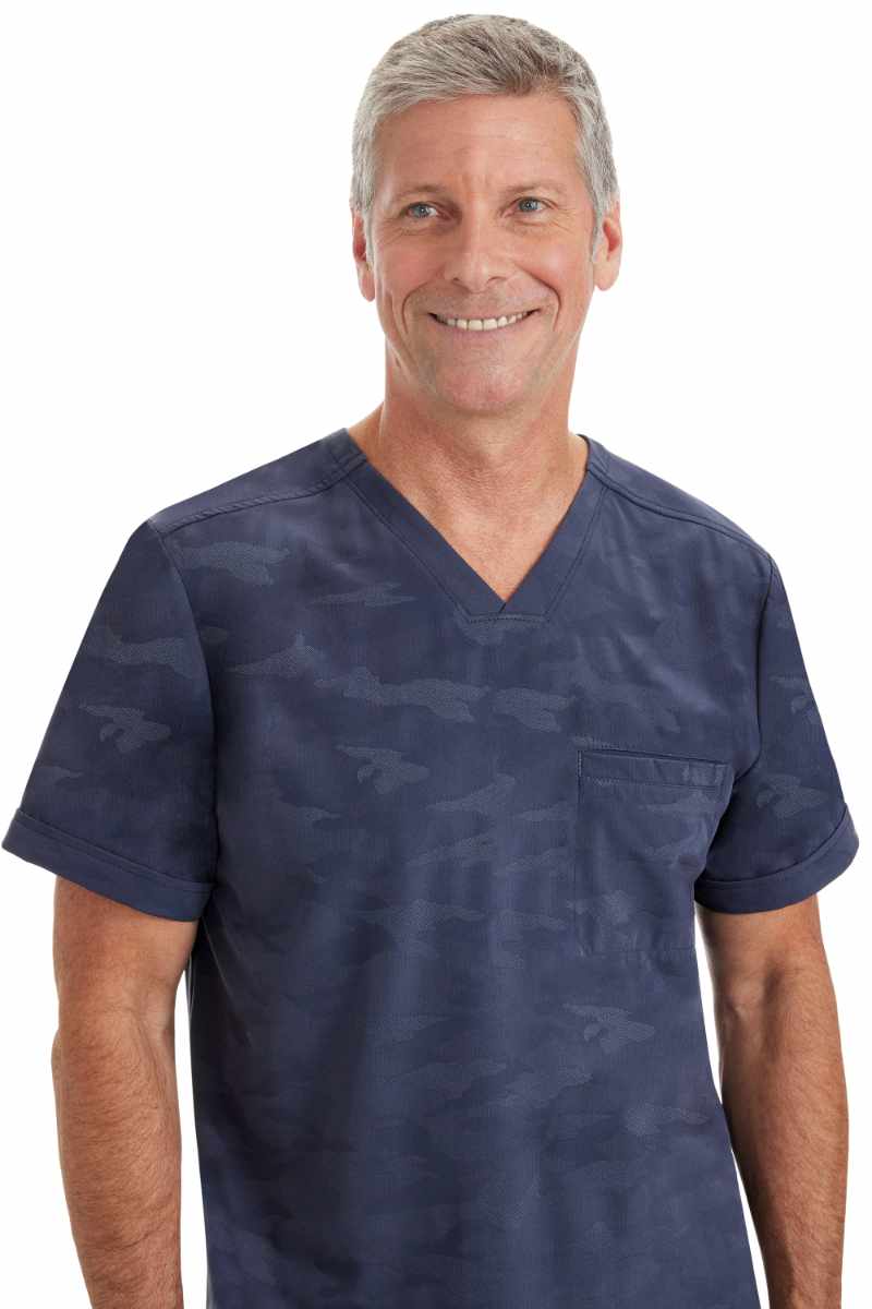 An up close image of the Purple Label by Healing Hands Men's Jack Camo Scrub Top in "Pewter" size Small featuring a subtle camo design throughout.