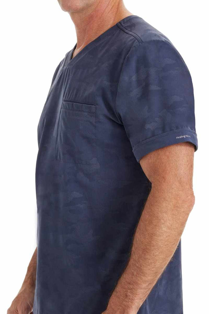 A male Physical Therapist wearing a Purple Label by Healing Hands Men's Jack Camo Top in "Pewter" size 2XL featuring folded cuffs at the sleeves.