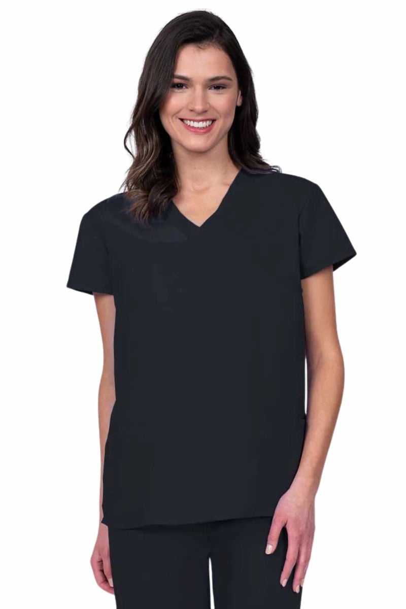 Young woman wearing a Luv Scrubs by MedWorks Women's Mock Wrap Scrub Top in black featuring a Y-neckline and side slits for additional range of motion.