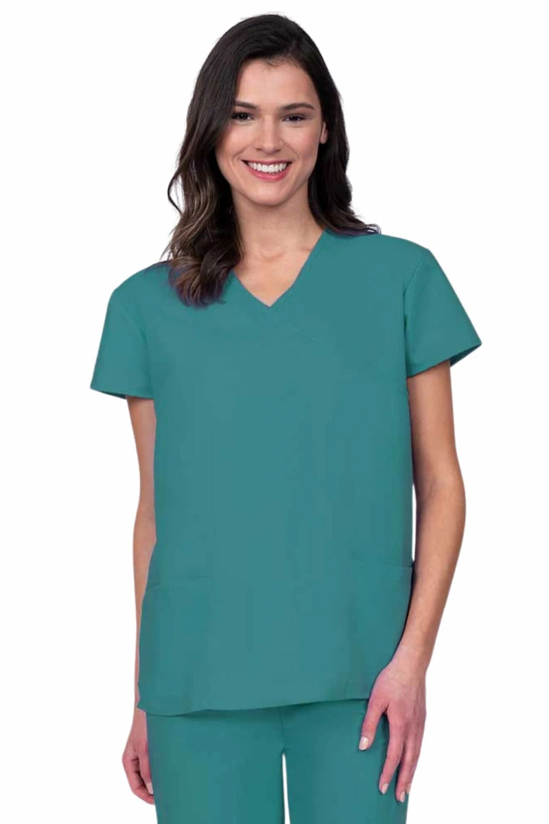 Young woman wearing a Luv Scrubs by MedWorks Women's Mock Wrap Scrub Top in teal featuring a Y-neckline and side slits for additional range of motion.