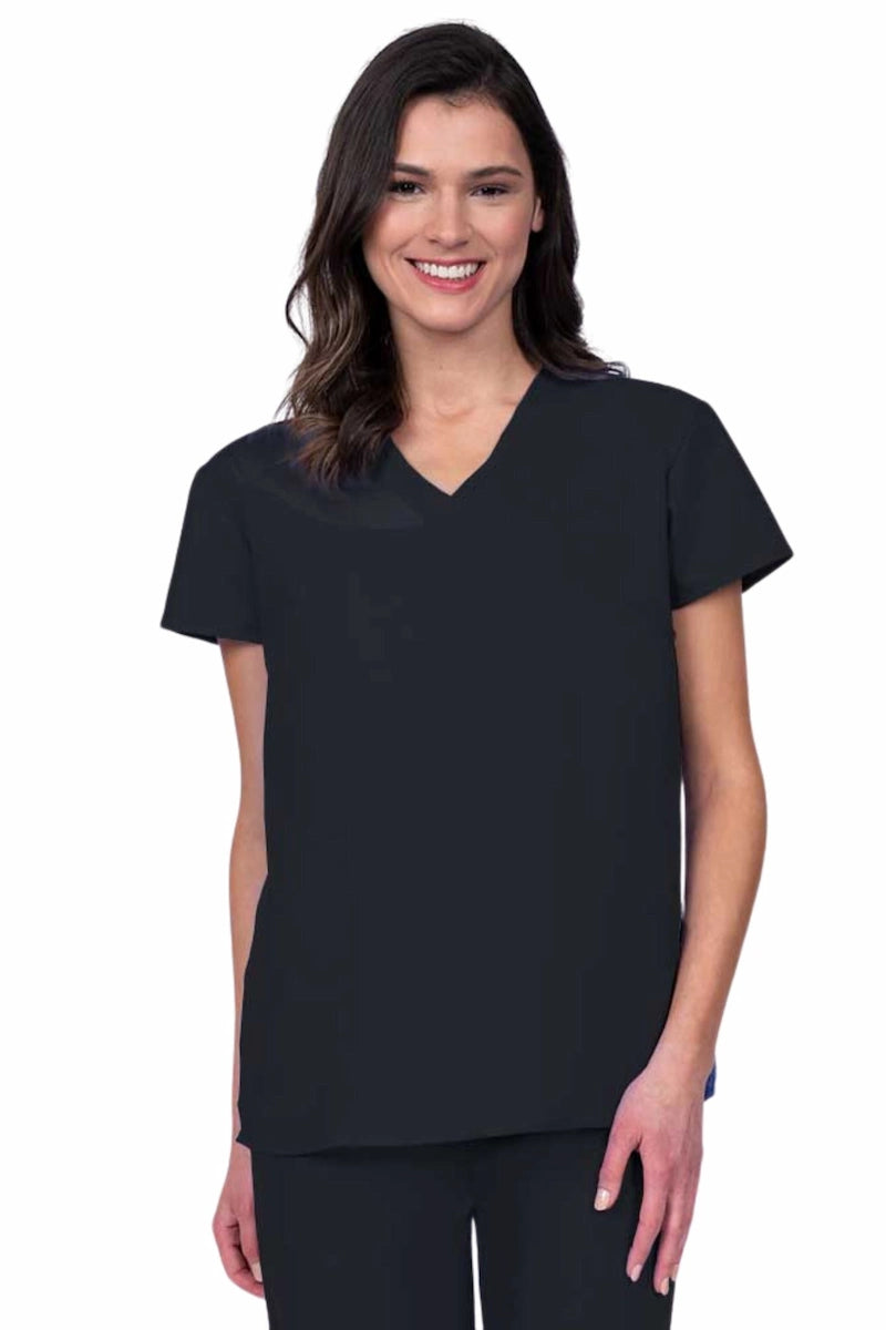 Nurse wearing a Luv Scrubs by MedWorks Women's Pocketless Mock Wrap Scrub Top in black featuring a Y-neckline & side slits for additional mobility.