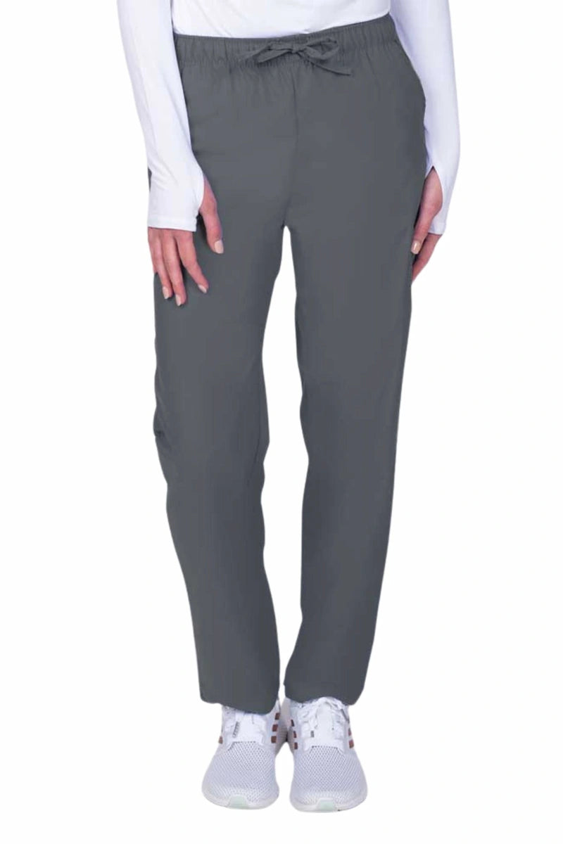 Young woman wearing a Luv Scrubs by MedWorks Women's Elastic Waist Cargo Pant in pewter featuring one cargo pocket on the wearer's left side.