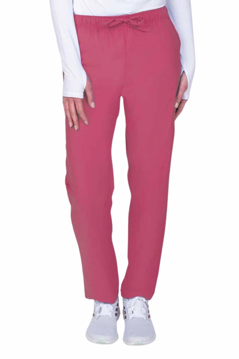 Young woman wearing a Luv Scrubs by MedWorks Women's Elastic Waist Cargo Pant in shocking pink featuring one cargo pocket on the wearer's left side.