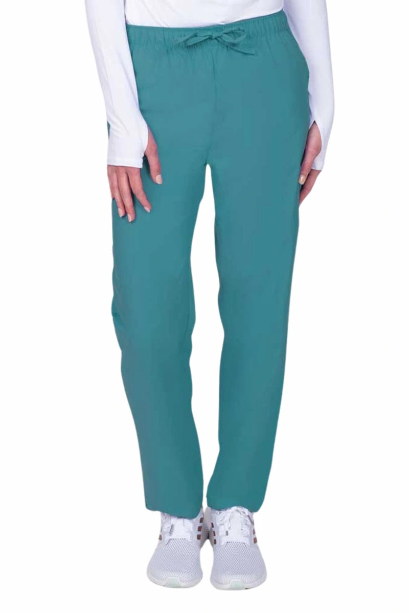 Young woman wearing a Luv Scrubs by MedWorks Women's Elastic Waist Cargo Pant in teal featuring one cargo pocket on the wearer's left side.