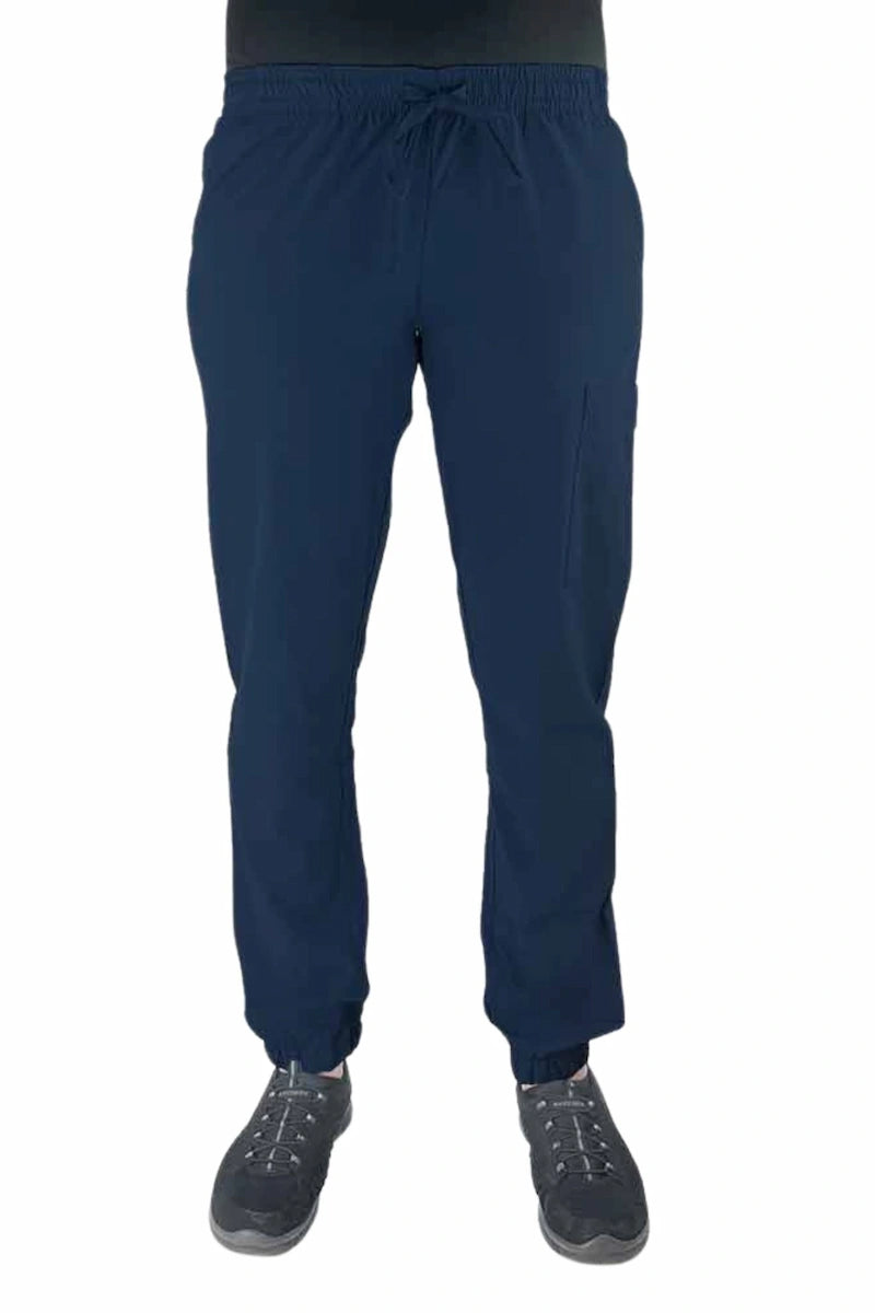 Young female healthcare worker wearing a Luv Scrubs by MedWorks Women's Scrub Jogger in navy with 2 front slash pockets & 1 cargo pocket on wearer's left leg.