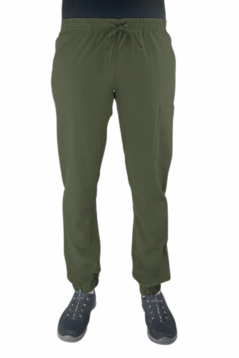 Young female healthcare worker wearing a Luv Scrubs by MedWorks Women's Scrub Jogger in olive with 2 front slash pockets & 1 cargo pocket on wearer's left leg.