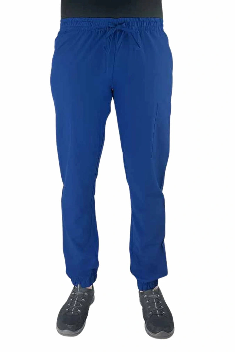 Young female healthcare worker wearing a Luv Scrubs by MedWorks Women's Scrub Jogger in royal with 2 front slash pockets & 1 cargo pocket on wearer's left leg.