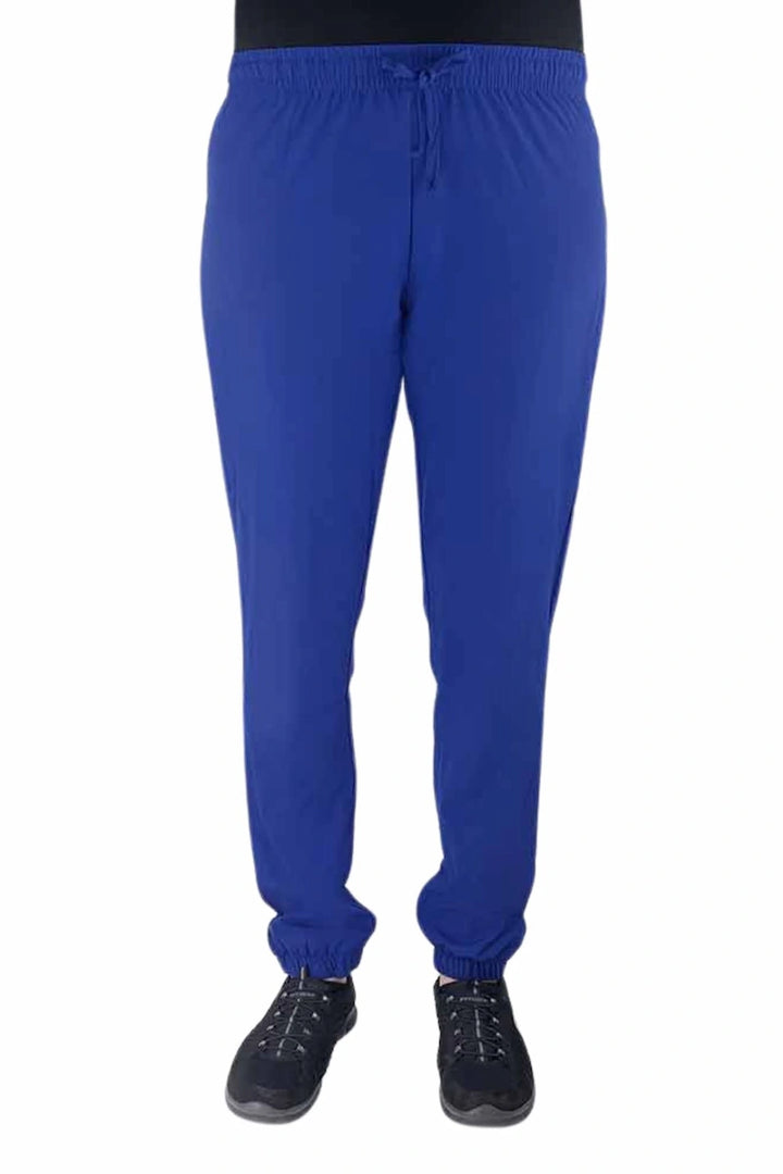 Nurse wearing a Luv Scrubs by MedWorks Women's Pocketless Jogger in royal with an elastic, drawstring waist.