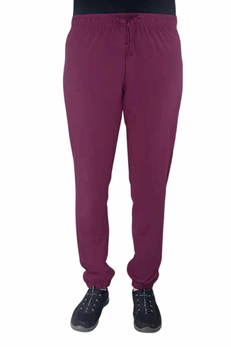 Nurse wearing a Luv Scrubs by MedWorks Women's Pocketless Jogger in wine with an elastic, drawstring waist.