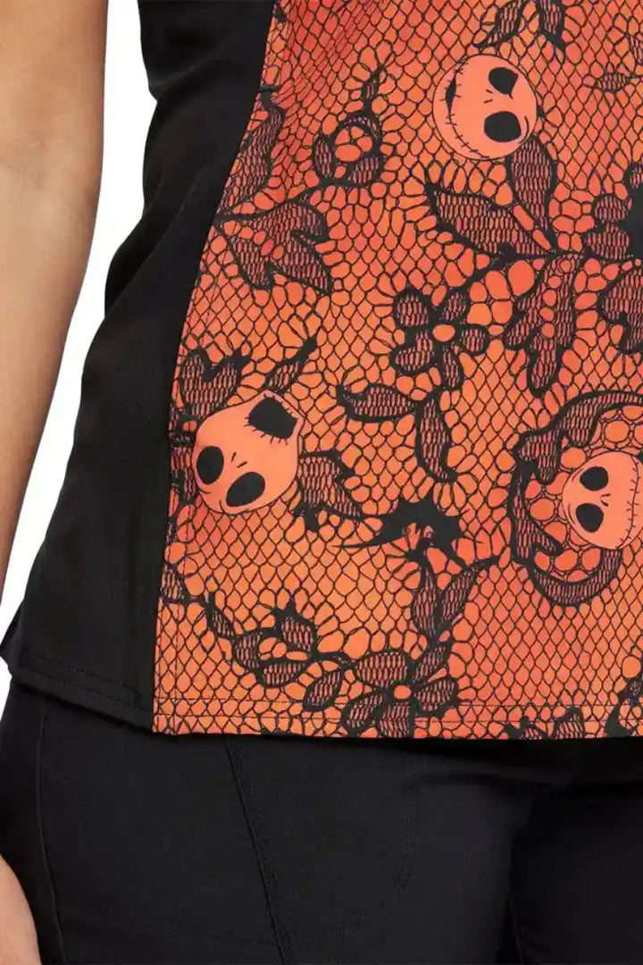 An up close shot of the double needle stitch detail throughout the Tooniforms Women's V-Neck Halloween Printed Scrub Top in "Undying Love".