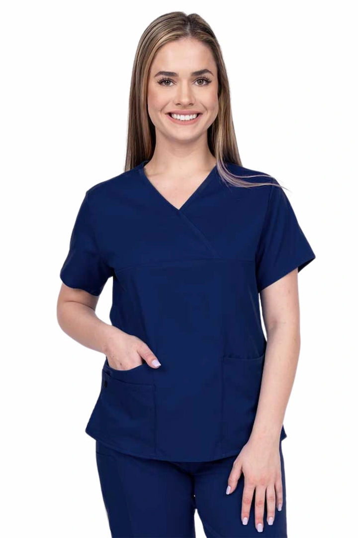 Woman wearing an Epic by MedWorks Women's Y-Neck Scrub Top in navy with a super soft, 2-way stretch fabric designed to move with your body all day long.