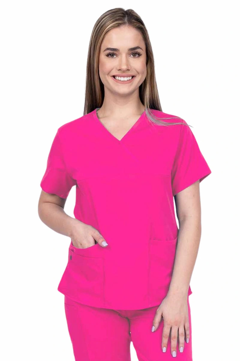 Woman wearing an Epic by MedWorks Women's Y-Neck Scrub Top in shocking pink with a super soft, 2-way stretch fabric designed to move with your body all day long.