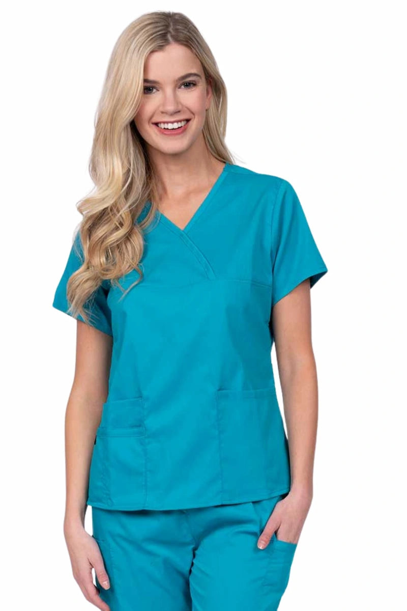 Woman wearing an Epic by MedWorks Women's Y-Neck Scrub Top in teal with a super soft, 2-way stretch fabric designed to move with your body all day long.