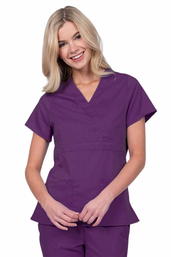 Young woman wearing an Epic by MedWorks Women's Mock Wrap Scrub Top in eggplant with a unique fabric content of 77% Polyester, 21% Viscose, 2% Spandex.