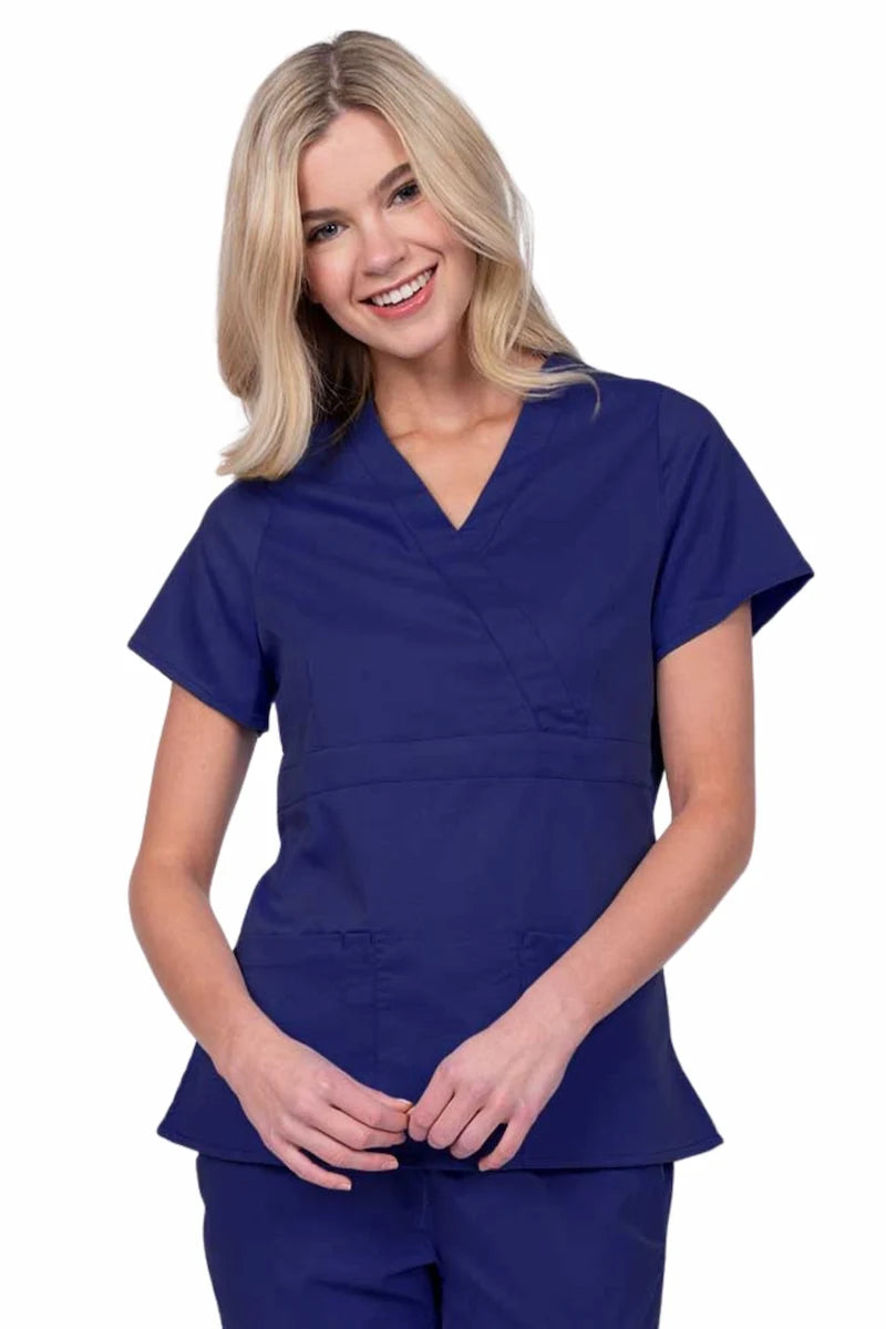 Young woman wearing an Epic by MedWorks Women's Mock Wrap Scrub Top in navy with a unique fabric content of 77% Polyester, 21% Viscose, 2% Spandex.