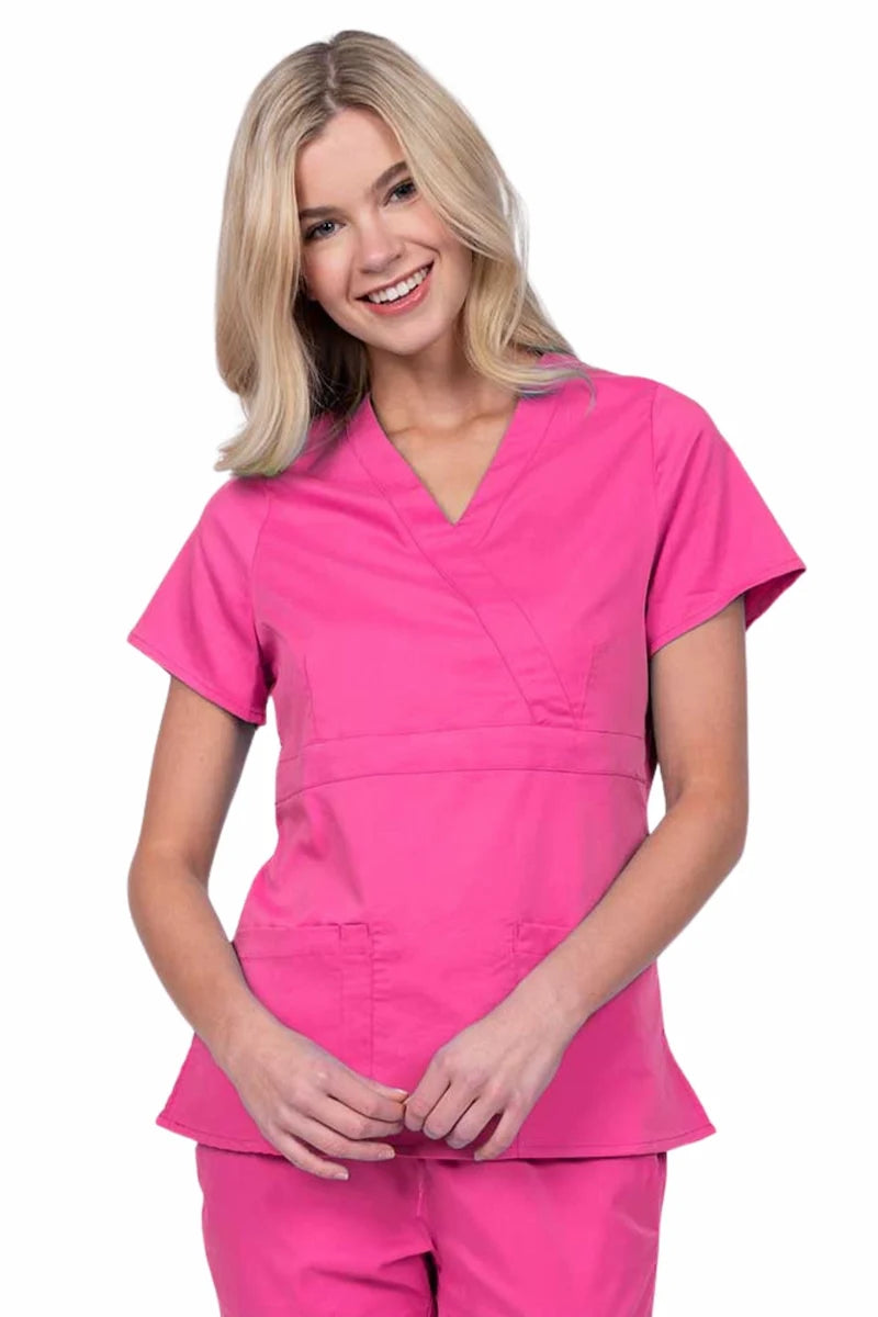 Young woman wearing an Epic by MedWorks Women's Mock Wrap Scrub Top in shocking pink with a unique fabric content of 77% Polyester, 21% Viscose, 2% Spandex.