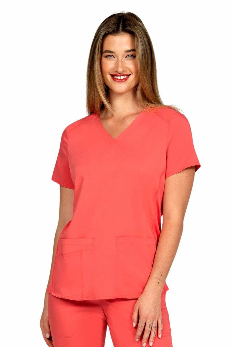 A female Phlebotomist wearing an Epic by MedWorks Women's Blessed Scrub Top in Coral size Medium featuring a v-neckline & short sleeves.