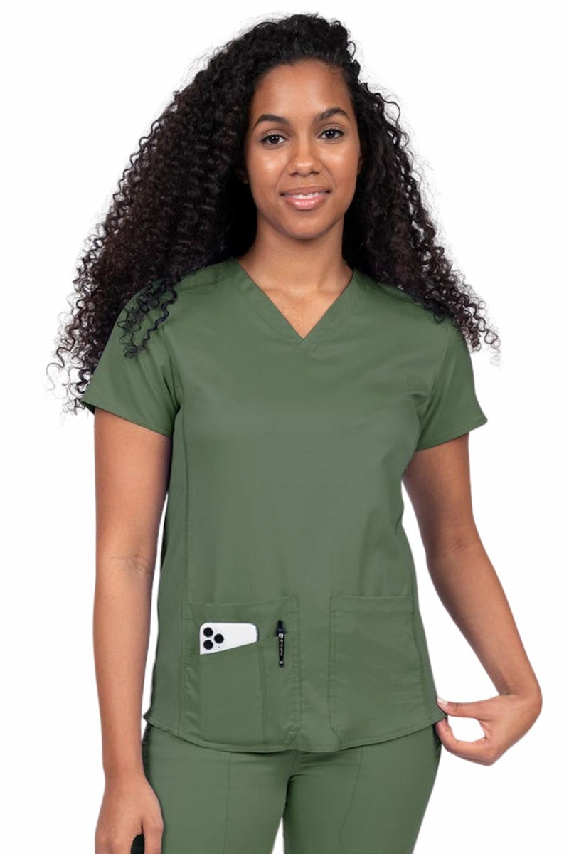 Nurse wearing an Epic by MedWorks Women's Blessed Scrub Top in olive with a V-neckline & short sleeves.