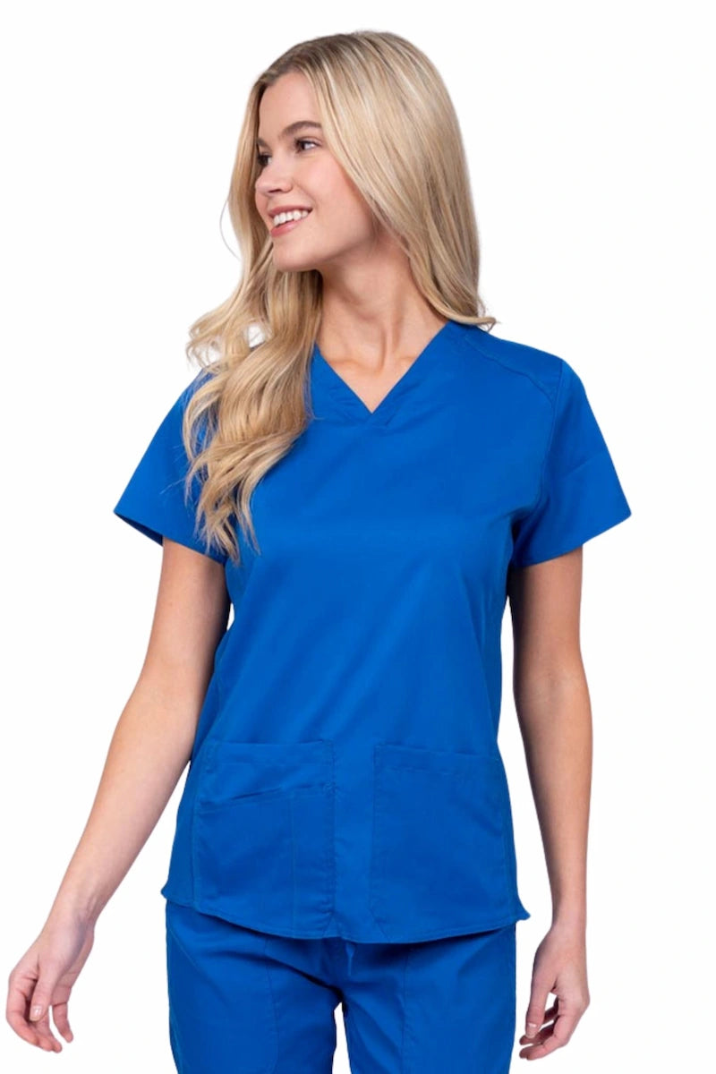 Nurse wearing an Epic by MedWorks Women's Blessed Scrub Top in royal with a V-neckline & short sleeves.