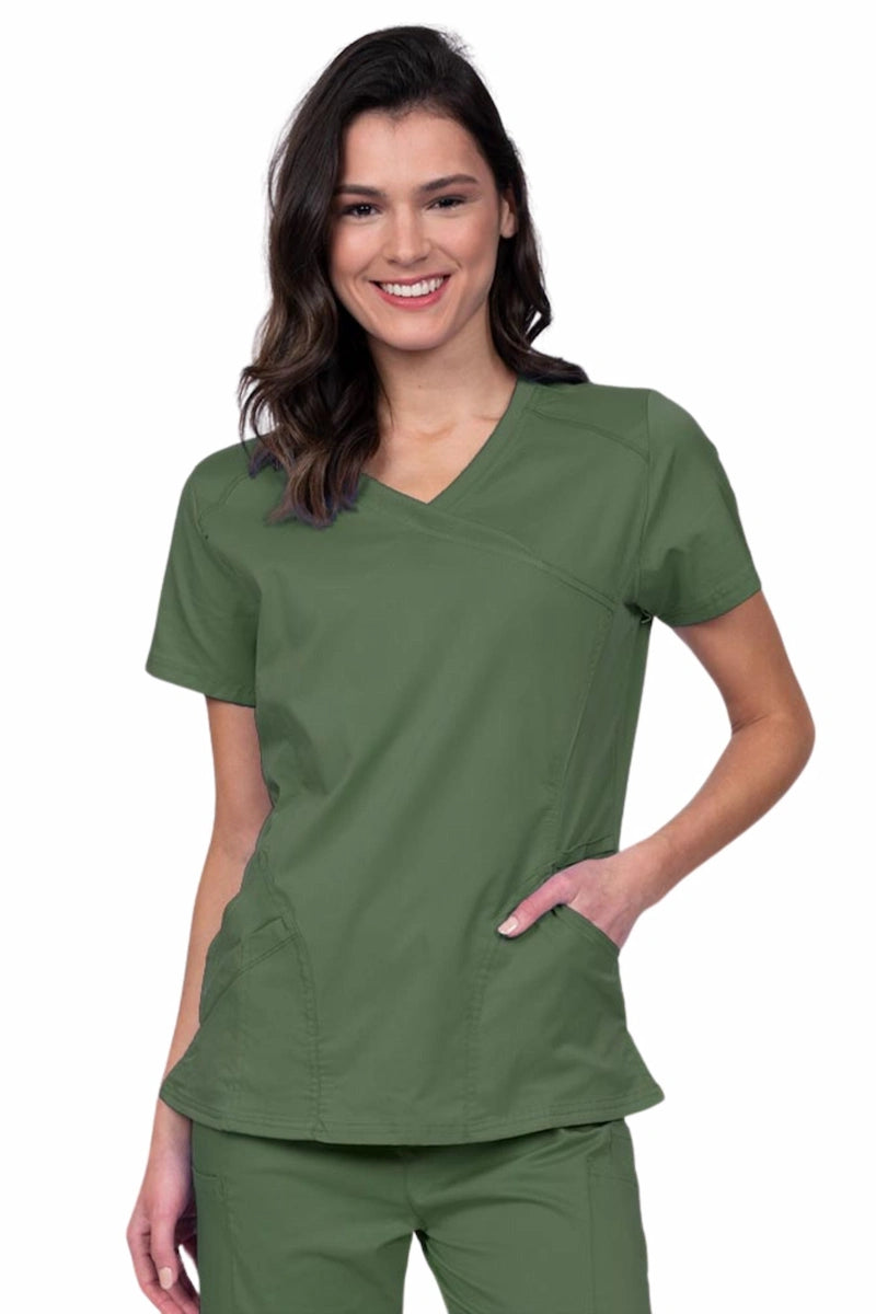 Young RN wearing an Epic by MedWorks Women's Knit Collar Mock Wrap Scrub Top in olive featuring a Y-neckline with short sleeves.