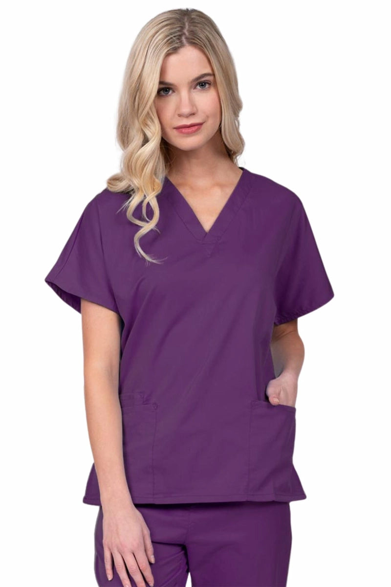 Young nurse wearing an Epic by MedWorks Unisex V-Neck Scrub Top in eggplant with a unique, easy care fabric made of 77% polyester, 21% Viscose and 2% Spandex.