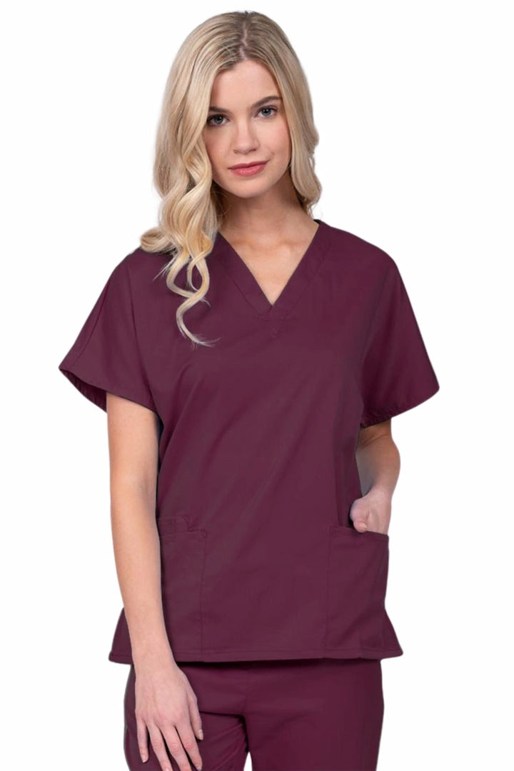 Young nurse wearing an Epic by MedWorks Unisex V-Neck Scrub Top in wine with a unique, easy care fabric made of 77% polyester, 21% Viscose and 2% Spandex.