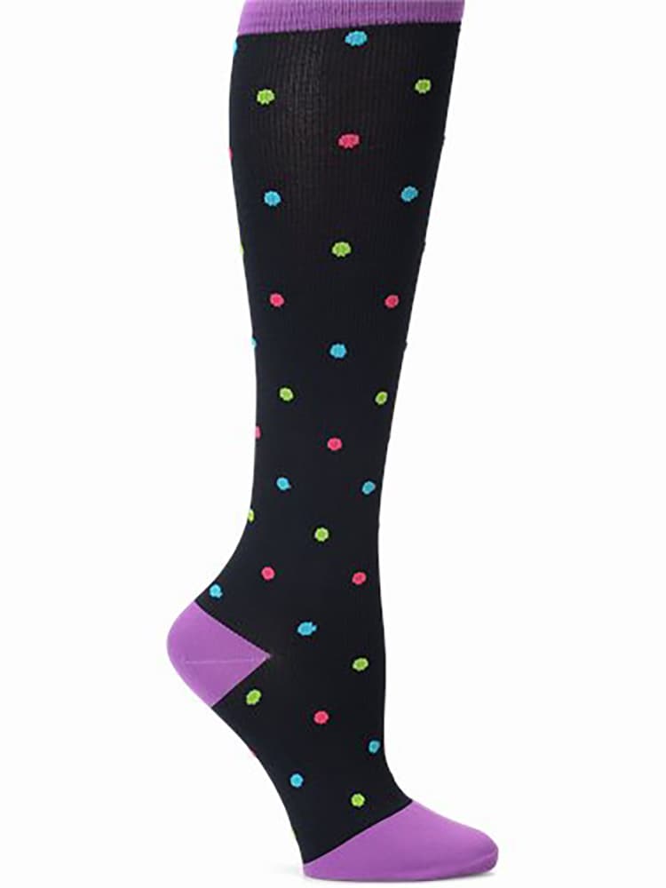 An image of the side of the NurseMates Women's Wide Calf Compression Socks in Bright Dots featuring 12-14 mmHg Graduated Compression to help improve circulation and relieve leg fatigue.