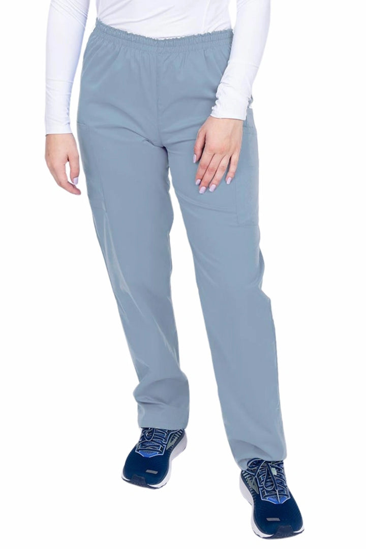 Young woman wearing an Epic by MedWorks Women's Elastic Waist Scrub Pant in blue fog featuring a tapered leg and elastic waist.