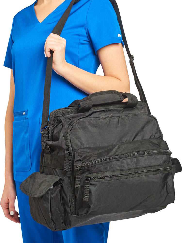 A young female CNA carrying the Nurse Mates Ultimate Medical Bag in "Black" featuring a hardwearing shoulder strap.