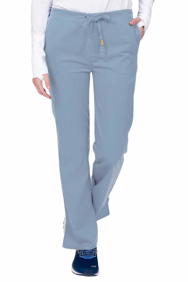 Young nurse wearing an Epic by MedWorks Women's Drawstring Flare Leg Scrub Pant in blue fog with unique stretch fabric made of 77% Polyester, 21% Viscose, 2% Spandex.