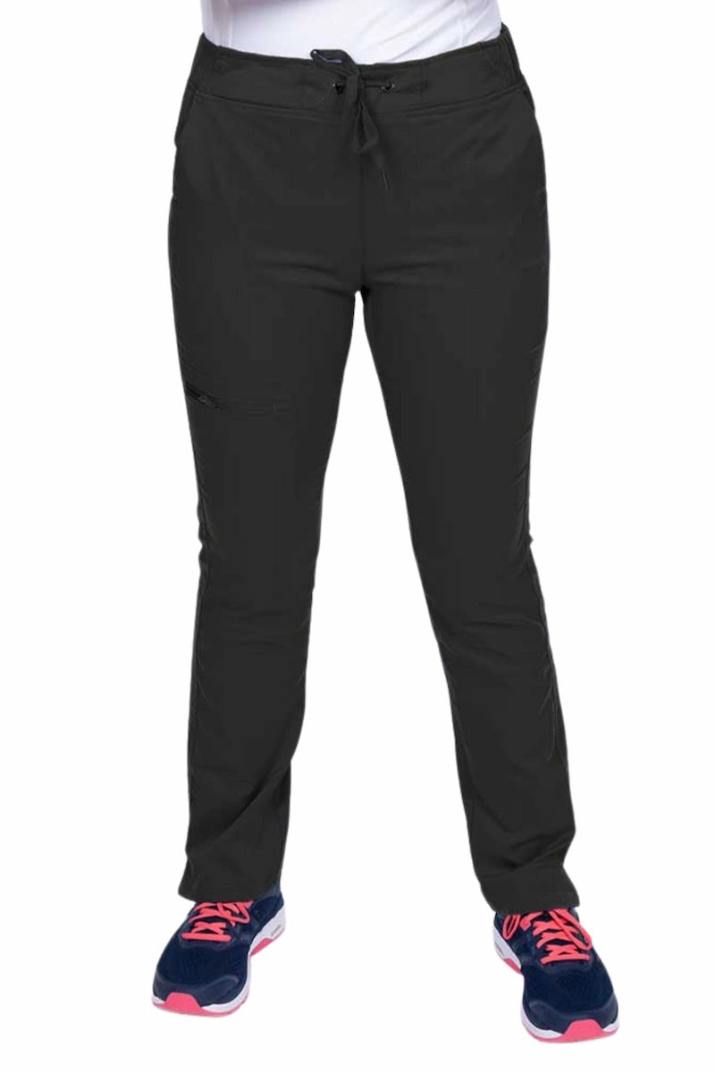 Young healthcare worker wearing an Epic by MedWorks Women's Blessed Skinny Yoga Scrub Pant in black featuring side slits for additional range of motion.