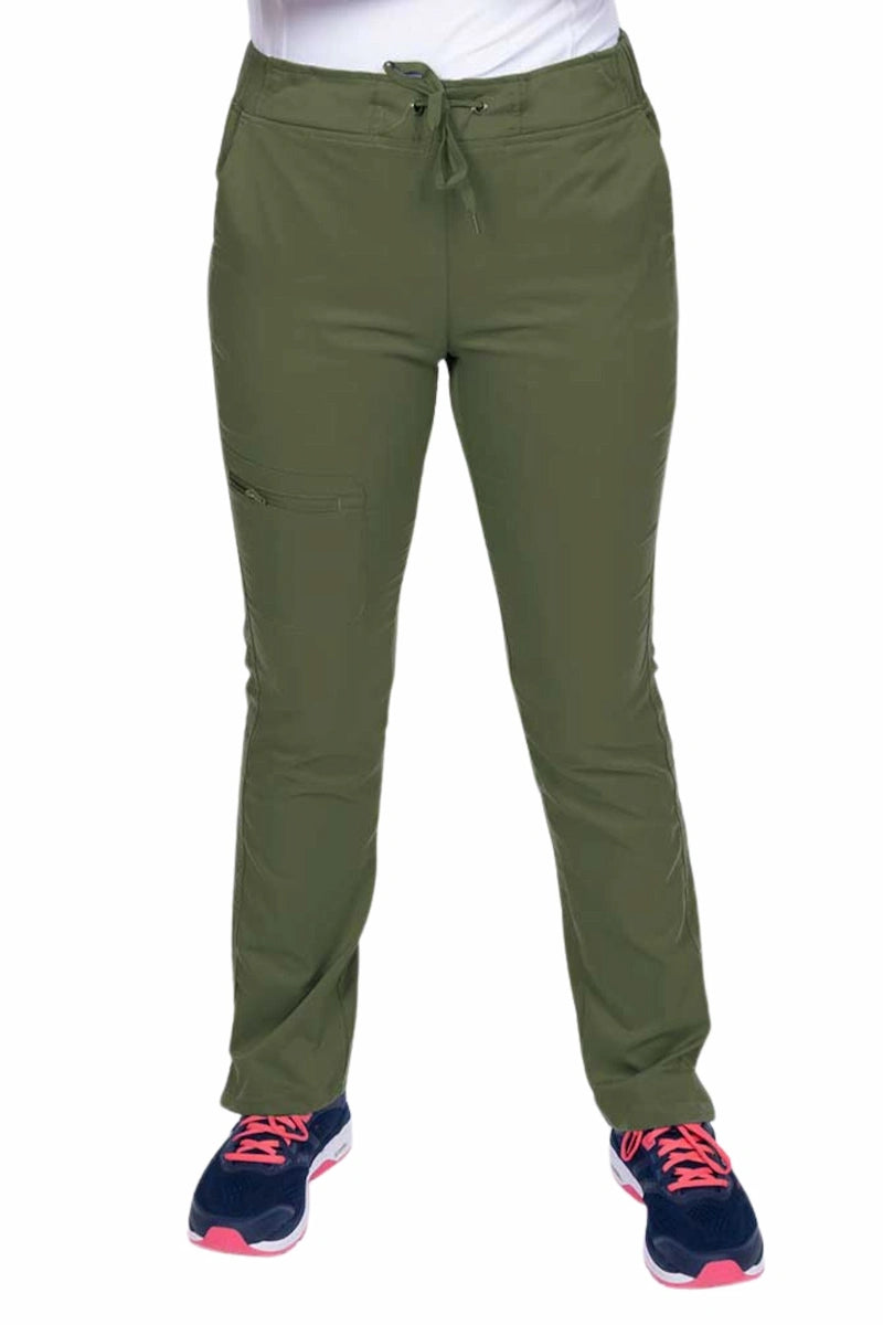 Young healthcare worker wearing an Epic by MedWorks Women's Blessed Skinny Yoga Scrub Pant in olive featuring side slits for additional range of motion.