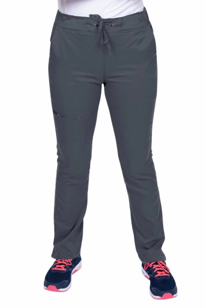 Young healthcare worker wearing an Epic by MedWorks Women's Blessed Skinny Yoga Scrub Pant in pewter featuring side slits for additional range of motion.