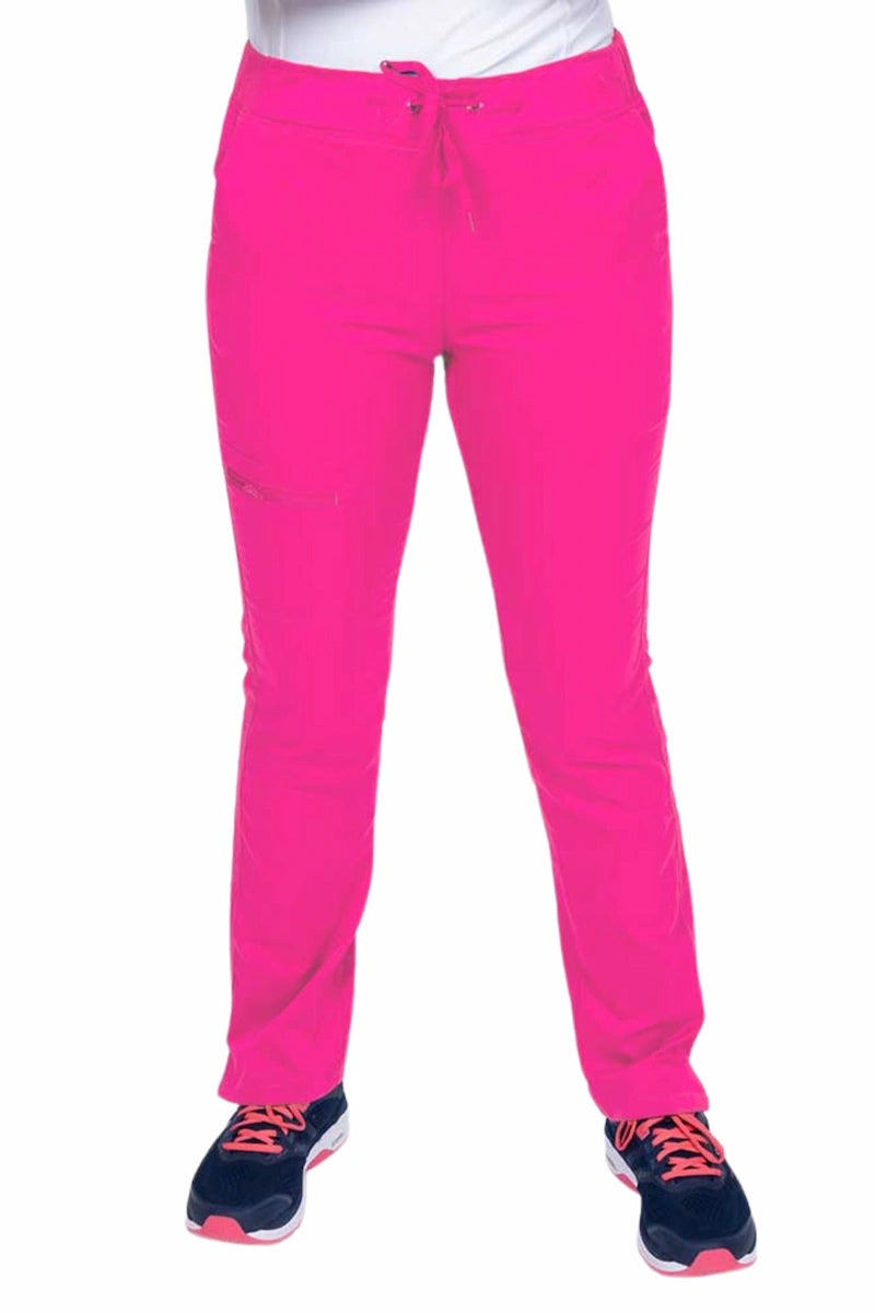 Young woman wearing an Epic by MedWorks Women's Skinny Yoga Scrub Pant in shocking pink with side slits for additional range of motion.