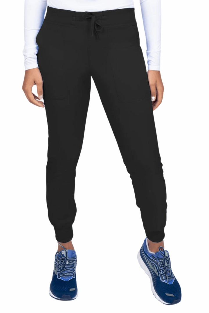 A young female Phlebotomist wearing an Epic by MedWorks Women's Yoga Jogger Scrub Pant in Black size 3XL featuring a contemporary fit.