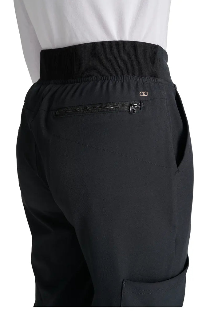 A close look at the back in-seam security zip pocket on the Allura Women's High Waist Gusset Scrub Jogger in Black.
