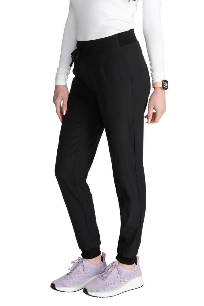 The Allura Women's High Waist Gusset Scrub Jogger in Black featuring rib knit cuffs at the ankle.