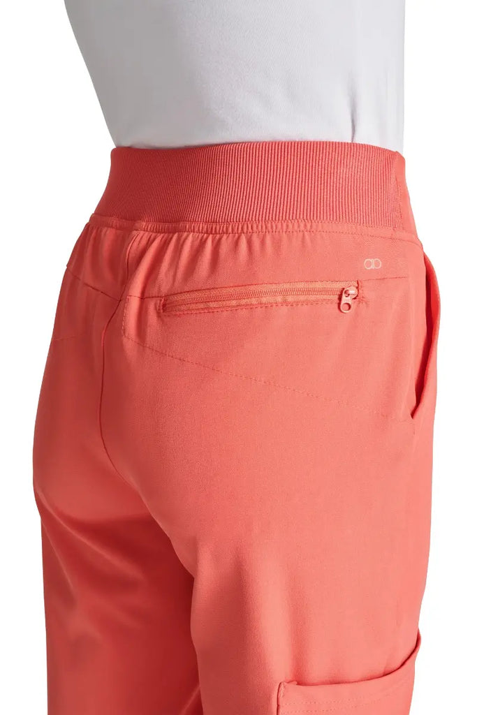 A close look at the back in-seam security zip pocket on the Allura Women's High Waist Gusset Scrub Jogger in Cayenne.